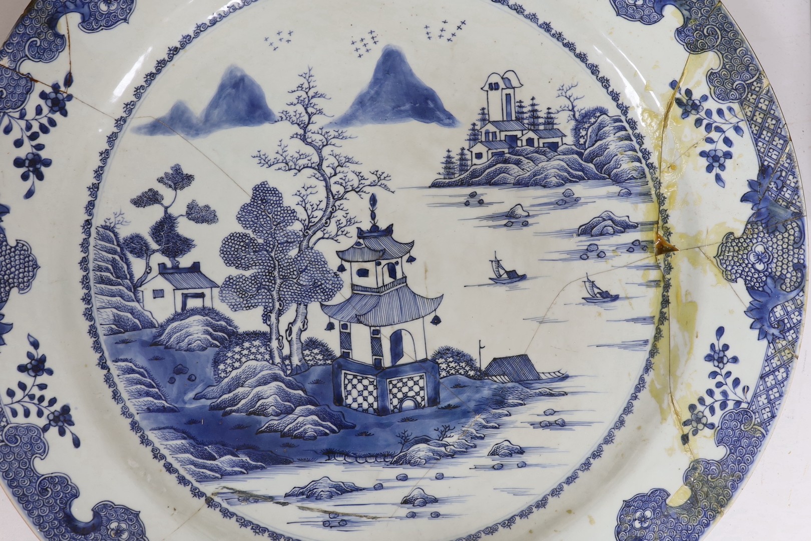 An 18th century Chinese export blue and white charger a.f., 55cms diameter